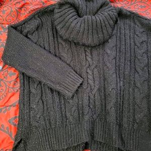 ...jennifer lopez black turtle neck sweater...